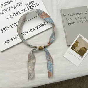 Vintage floral print skinny scarf with wooden beaded details, perfect for neck or hair styling.