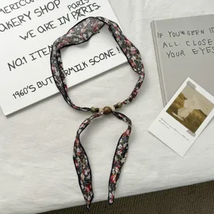 Vintage floral narrow scarf with beaded charms, elegant fabric neck ribbon for women styling.