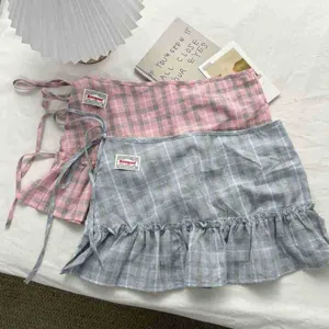 Ruffled plaid layering skirt detail, high waist A-line skirt with cute ribbon tie and hem.