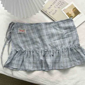 Plaid ruffled mini skirt vintage preppy style wrap skirt with cute side tie details.