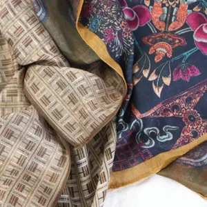 Detail view of vintage double-sided silk scarf featuring elegant floral and geometric patterns.