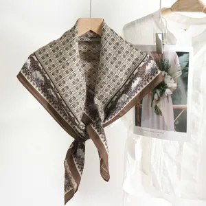 Detailed view of the vintage geometric printed silk-feel large square scarf accessory.