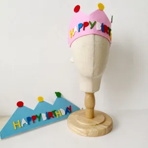 Felt birthday crown hat with colorful letters, ideal for kids party decoration details.