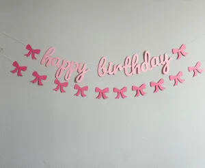Pink bow birthday banner detail, happy birthday letter garland for baby party decoration.