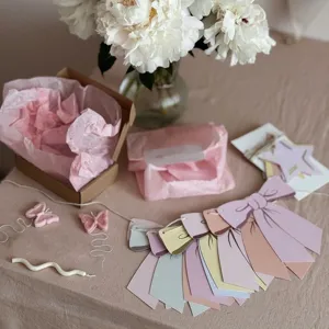 Macaron bow paper garland banner for kids birthday party and cute bedroom wall decoration.