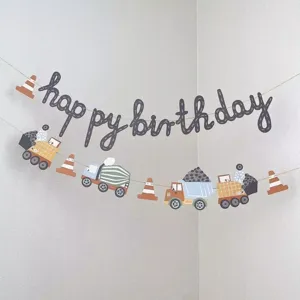 Detailed view of kids birthday party hanging banner with cute engineering cars and letter design.