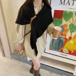 Black knitted triangle shawl cape with buckle, versatile scarf wrap for autumn and winter.