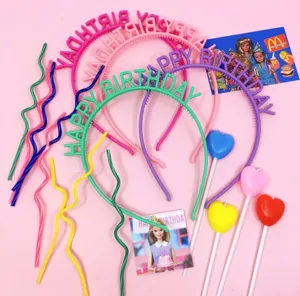 Colorful birthday party hairbands set with happy birthday letters, straws and candles.