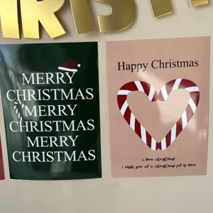 Christmas poster wall detail showing festive holiday typography and candy cane card design.