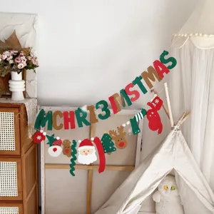 Christmas felt letter banner garland with Santa Claus and candy design for party decor detail.