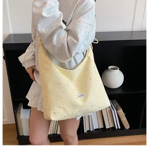 Yellow canvas shoulder bag with silver star print large capacity tote bag for women daily use