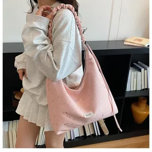 Chic pink slouchy canvas shoulder bag with ruffled strap and star print, large capacity tote.