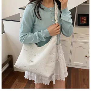 Stylish white canvas shoulder tote bag with star print and cute scrunchie strap design.