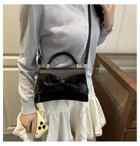 Stylish black women handbag shoulder crossbody bag with elegant bow design for daily wear.