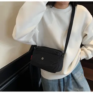 Minimalist black nylon crossbody bag, casual daily commuting shoulder bag for women.