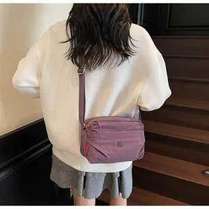 Casual purple nylon crossbody bag, lightweight daily shoulder bag with adjustable strap.