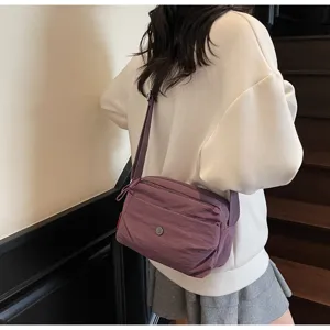 Purple nylon crossbody bag, lightweight minimalist shoulder bag for daily commute.