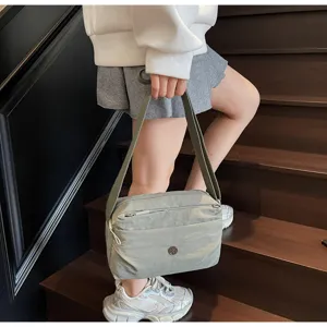 Lightweight nylon crossbody bag for daily commute, trendy casual shoulder bag with zipper.