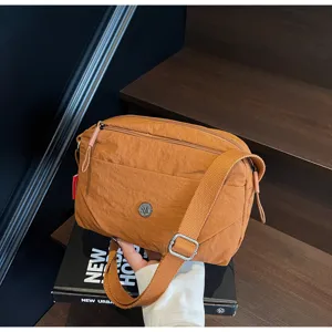 Brown nylon crossbody bag, casual everyday shoulder bag for women with adjustable strap.