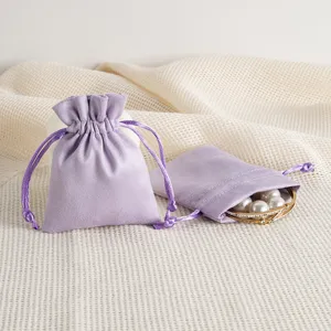 Light purple suede velvet jewelry pouch with drawstring closure, perfect for gift packing.