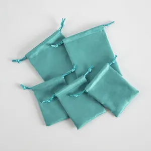 Turquoise velvet drawstring pouches for jewelry, earphones, and small gift packaging.
