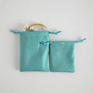 Teal velvet jewelry pouch set, soft drawstring bags for small gifts, trinkets, and accessories.