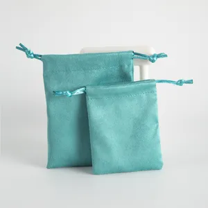 Teal velvet drawstring pouches for jewelry, small accessories and earphone storage organize.