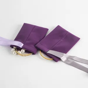 Purple velvet jewelry pouch detail showing soft fabric, drawstring ribbon, and inside accessories.