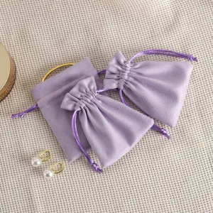 Purple suede jewelry pouch drawstring velvet gift bag for small accessories and necklaces.