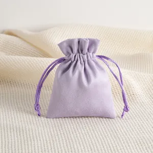 Detail view of a soft lavender velvet drawstring pouch, perfect for jewelry or gift storage.