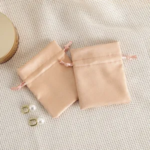 Pink velvet drawstring jewelry pouch set for accessory storage and gift packaging detail.