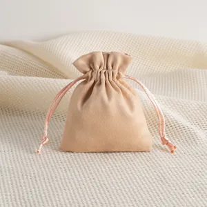 Detailed view of soft beige velvet drawstring pouch, perfect for jewelry and small gift storage.