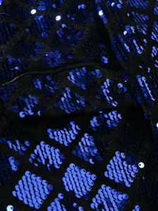 Men's sequin suit jacket fabric detail close-up showcasing blue diamond pattern.