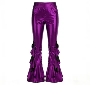 Detailed view of shiny purple metallic flare pants featuring black ruffle cuffs and high waist.