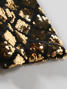 Detail view of men's sequin blazer fabric, featuring sparkling gold geometric sequin patterns.