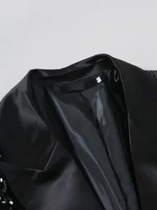 Men's black suit collar detail featuring sleek lining and peak lapels for formal wear.