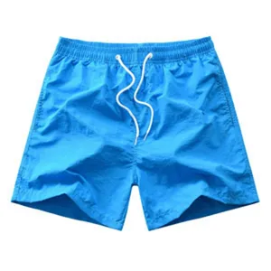 Short de plage homme bleu uni caleçon de bain décontracté d'été avec cordon de serrage blanc.
