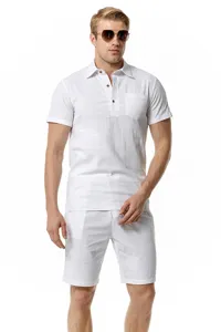 Close up view of the white linen polo shirt pocket and matching summer beach shorts.