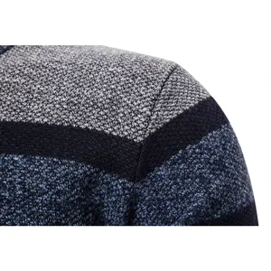 Close-up detail view of men's striped knit sweater shoulder, showing fine knitted texture.