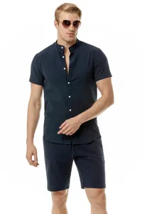 Men casual linen set detail shot showing henley collar short sleeve shirt and matching shorts.