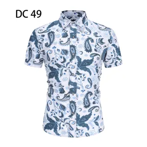 Detail view of men's short sleeve summer shirt with intricate blue paisley floral print pattern.