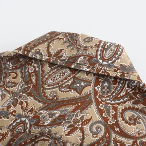 Detailed shot of men's paisley print short sleeve shirt collar, stylish summer beach top.