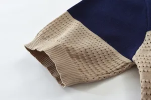 Close-up detail of mens knitwear featuring stylish color block and breathable mesh design.