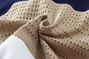 Close-up of breathable knit sweater fabric, detailed texture display for men's apparel.