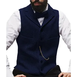 Detailed view of men's navy blue herringbone suit vest with a stylish pocket watch chain.