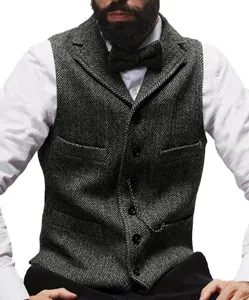 Men's grey herringbone tweed suit vest detail, classic lapel single-breasted waistcoat.