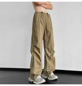 Pantalones paracaídas estilo urbano unisex para hombre y mujer, pantalón ancho con cordón ajustable.