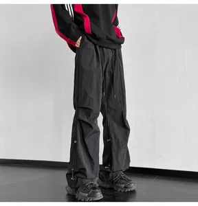 Pantalon paracaidas negro hombre mujer holgado cordon pierna ancha streetwear casual