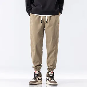 Men's casual cargo joggers khaki sweatpants, loose fit drawstring trousers for autumn daily wear.