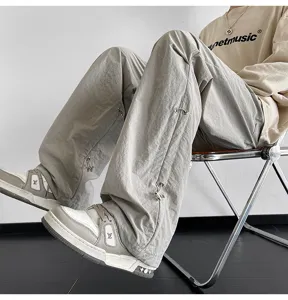 Pantalón paracaídas holgado casual para hombre y mujer, streetwear elegante con cordón.